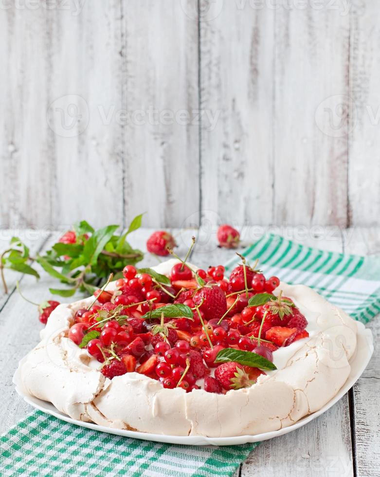 Meringue Cake Pavlova with cream and berries photo