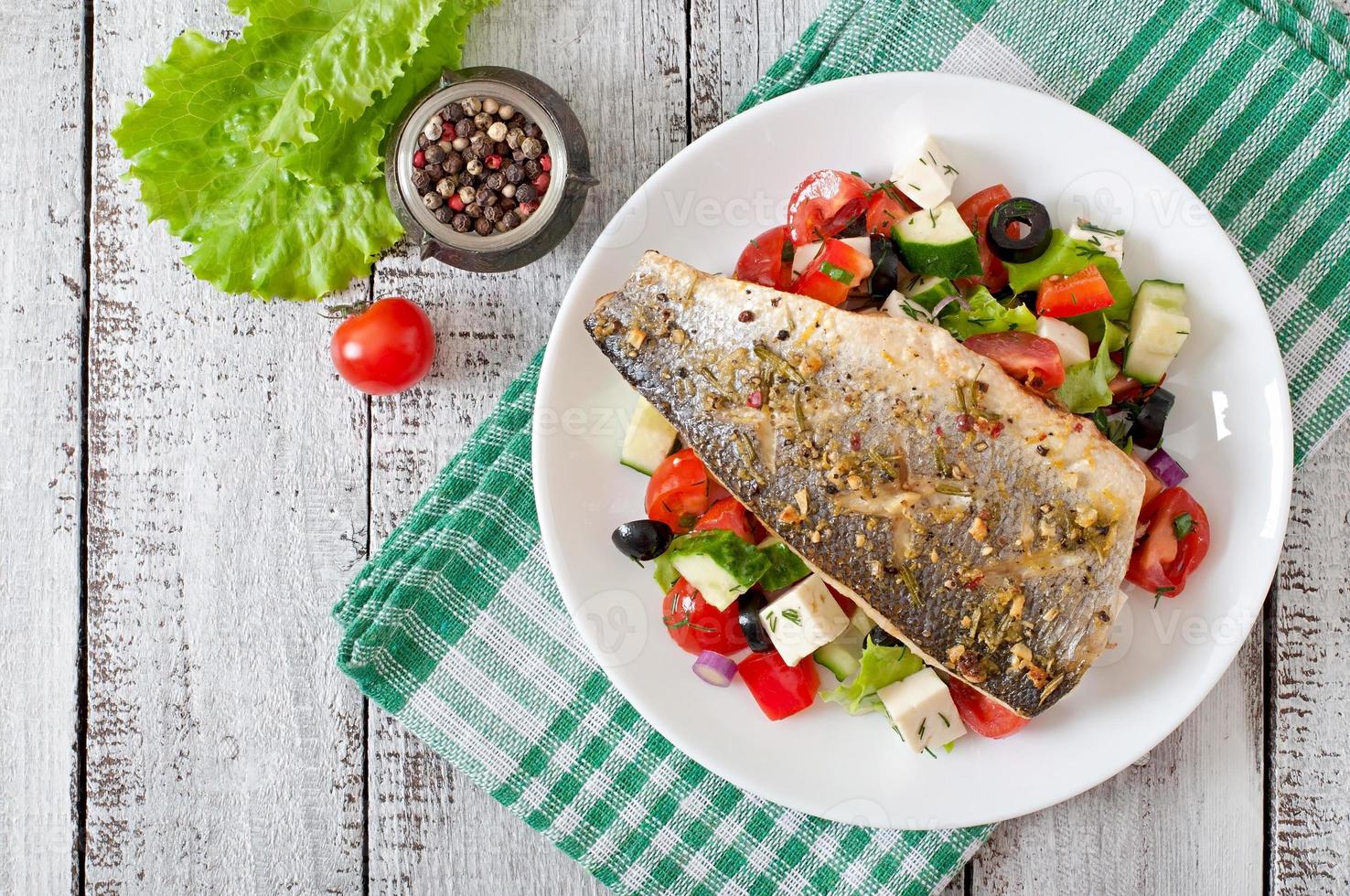 Baked seabass with Greek salad photo