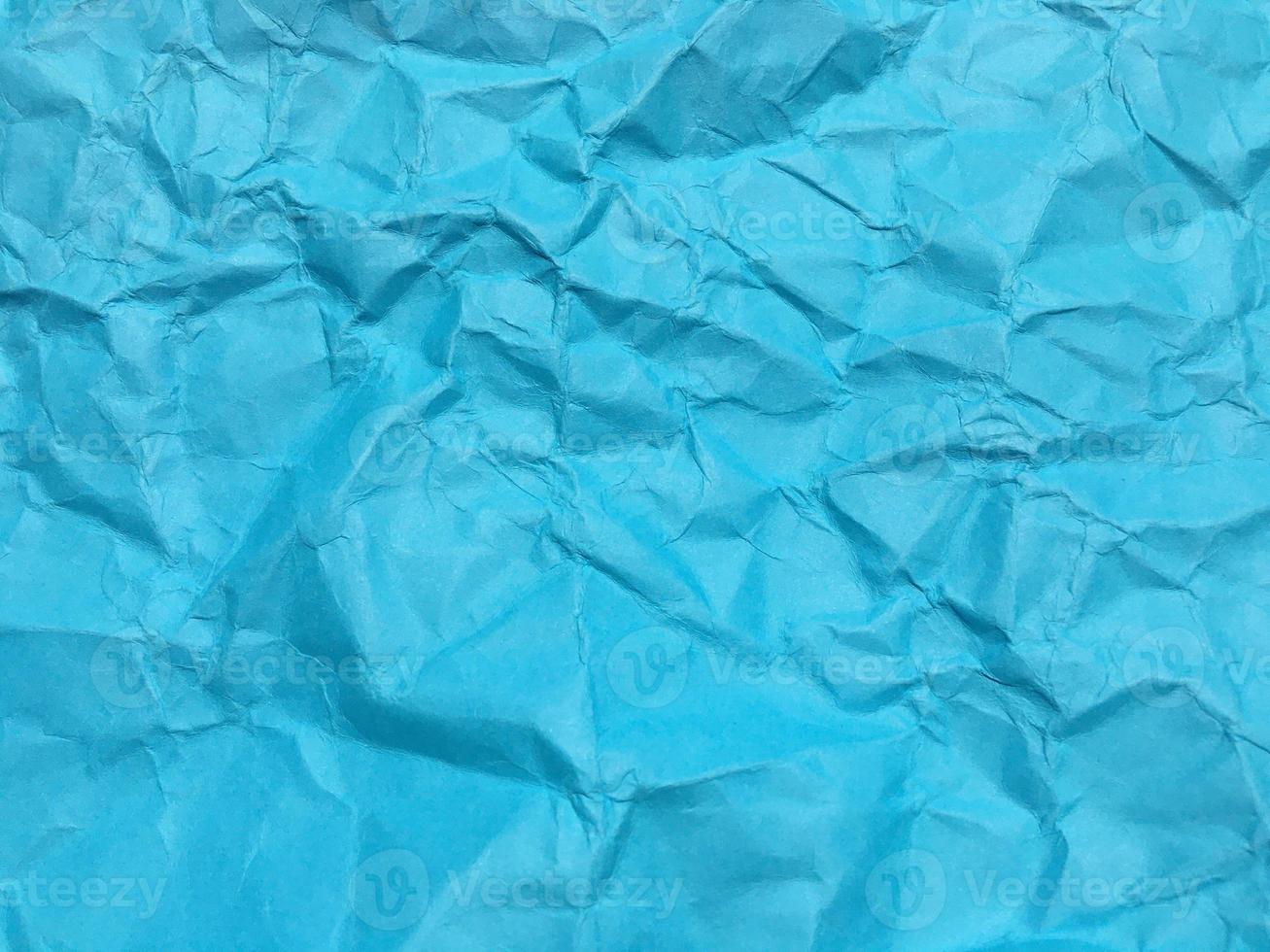 Modern blue crumpled paper texture background for Design. photo