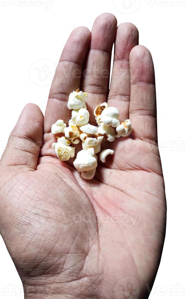 Top view of popcorn in boy's hand photo