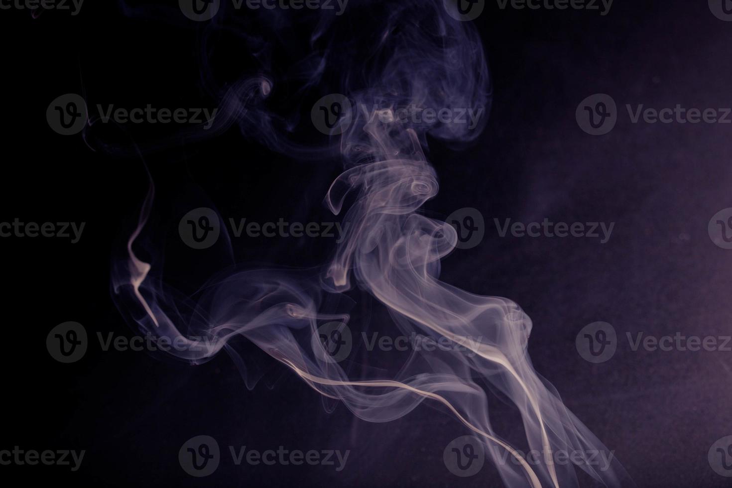 white smoke on a black background photo