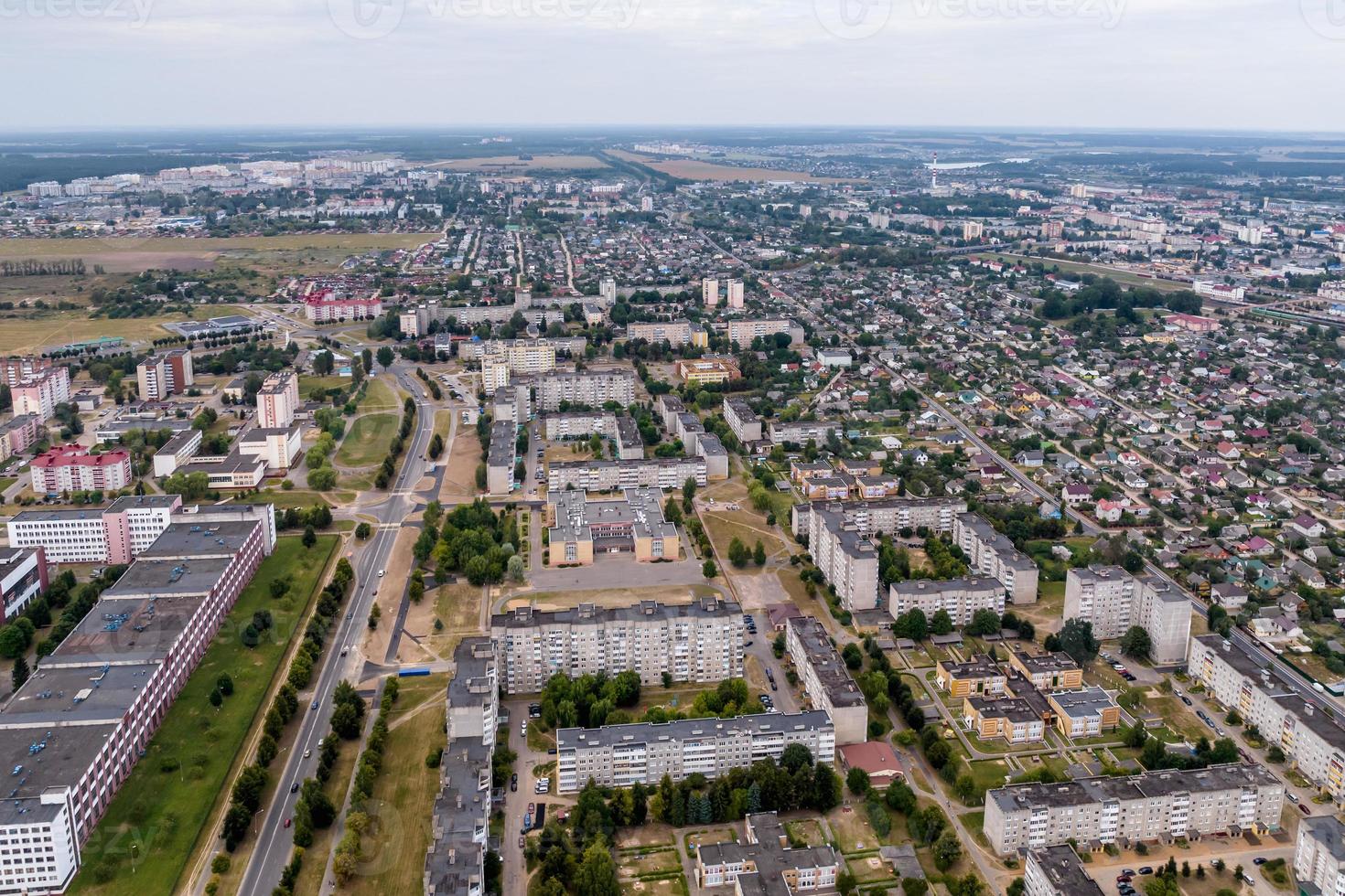 panoramic view from a great height of a small provincial town with a private sector and high-rise apartment buildings photo