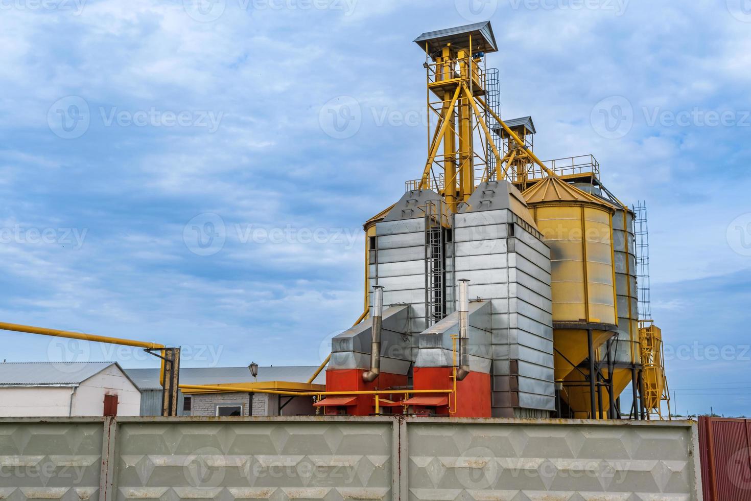 agro silos granary elevator with seeds cleaning line on agro-processing manufacturing plant for processing drying cleaning and storage of agricultural products in rye corn or wheat field photo