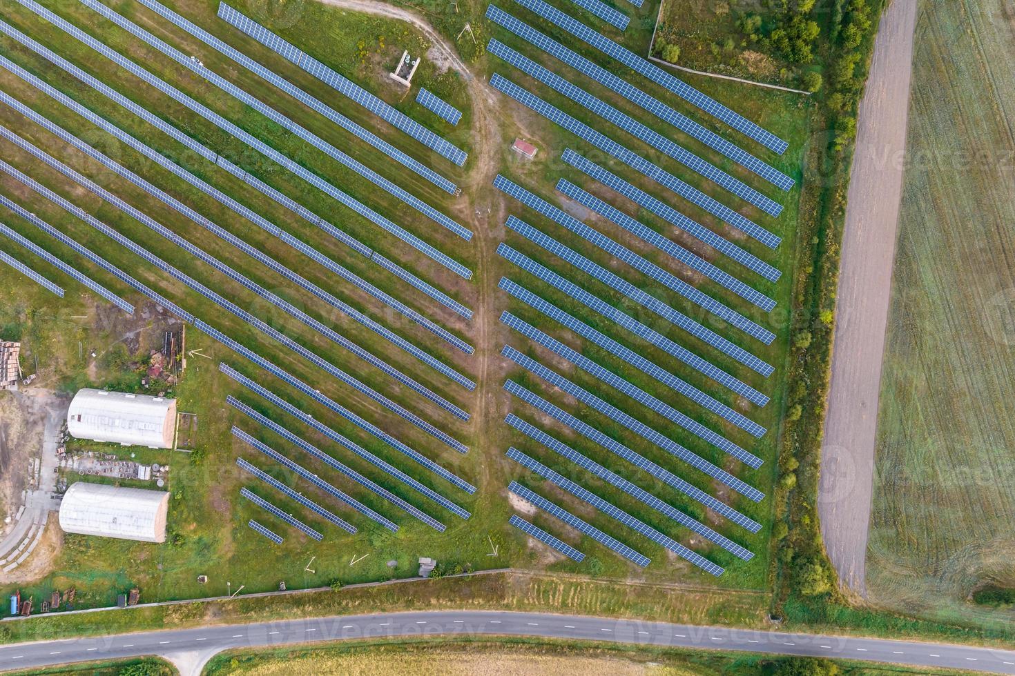 aerial view on farm field of solar panels. Renewable solar energy. photo