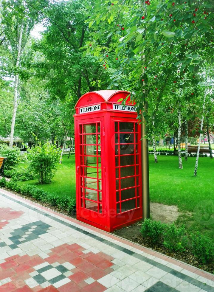 Red payphone booth in the English style in Gorky Park photo