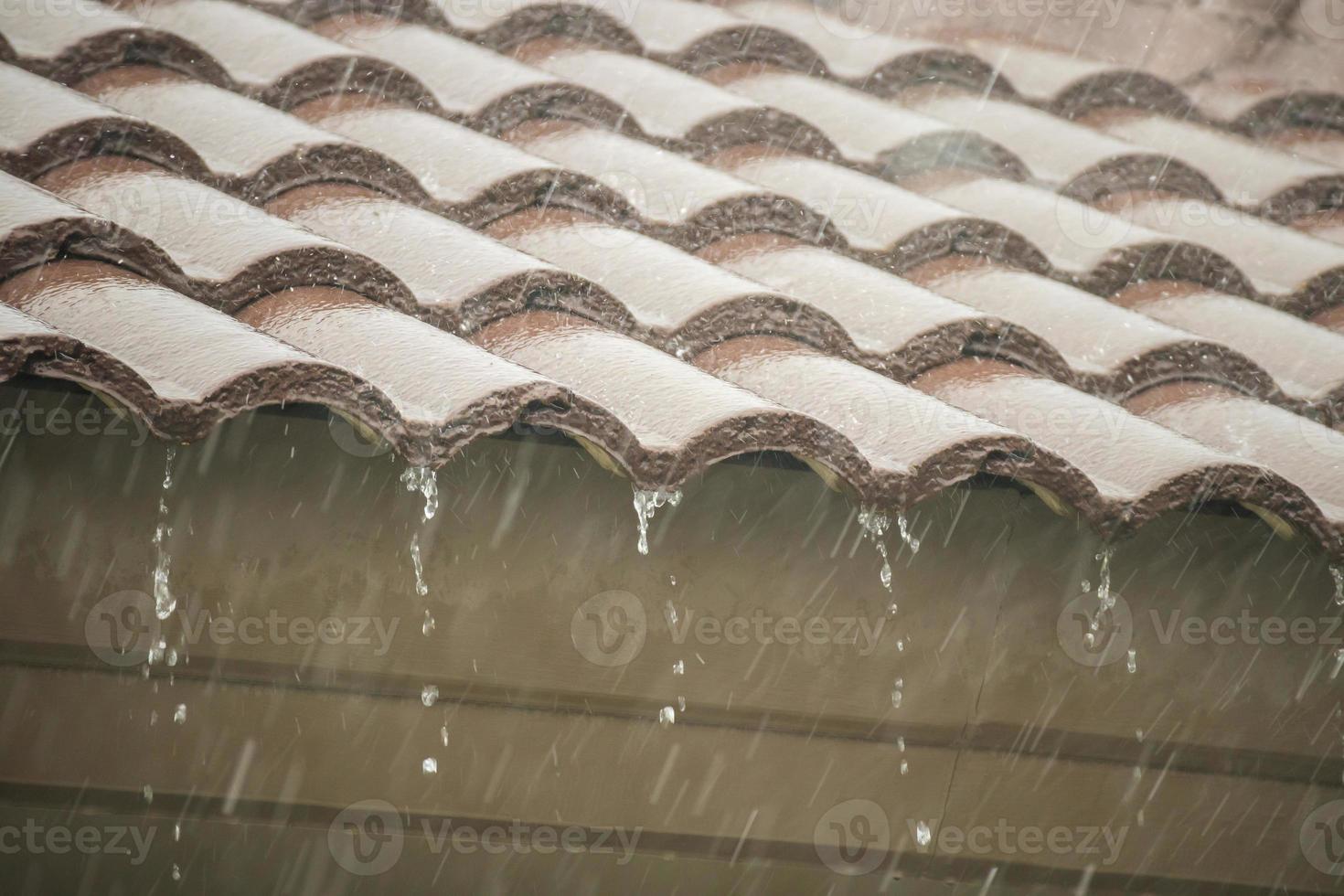 rain falling down from the house roof photo