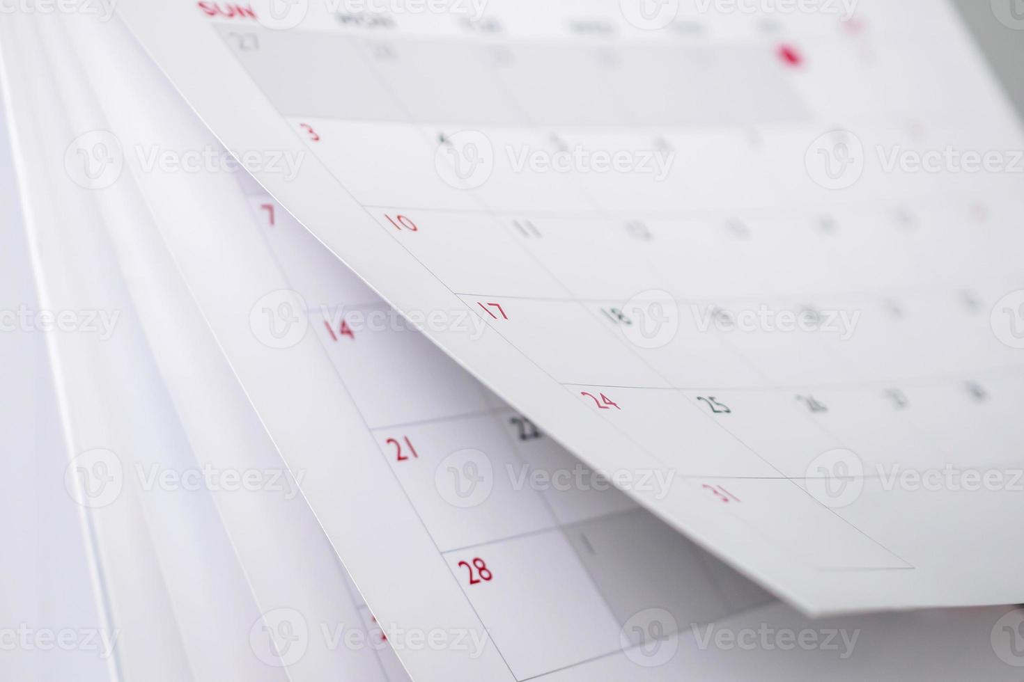 Calendar page flipping sheet close up blur background business schedule planning appointment meeting concept photo