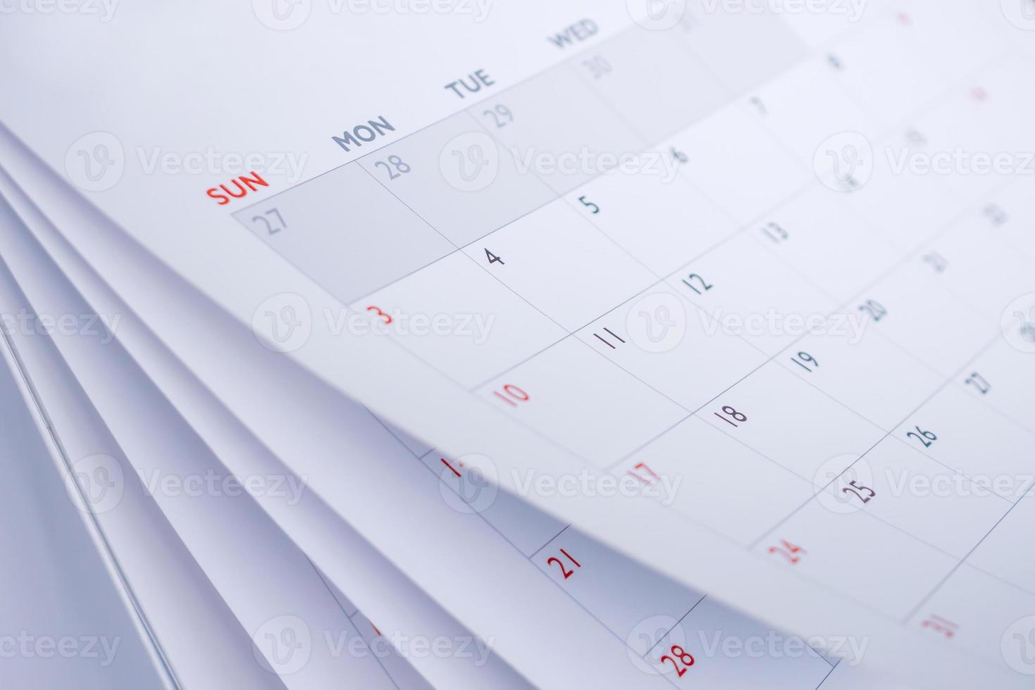 Calendar page flipping sheet close up blur background business schedule planning appointment meeting concept photo