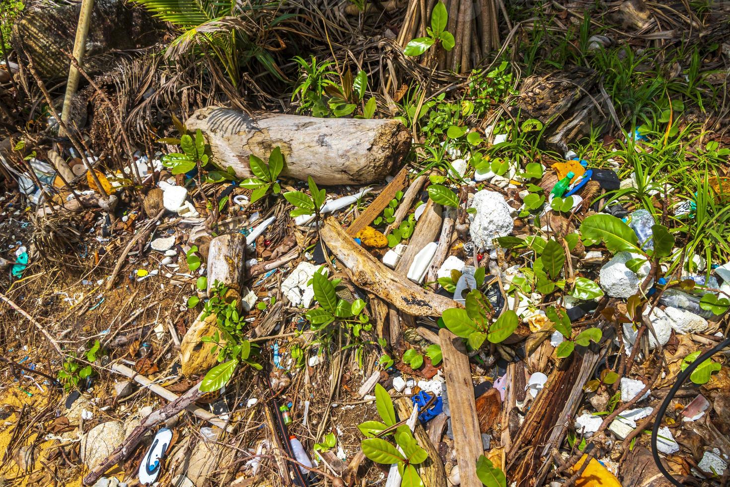 Garbage Dirt Plastic Poison Litter and Pollution on Beach Thailand. photo