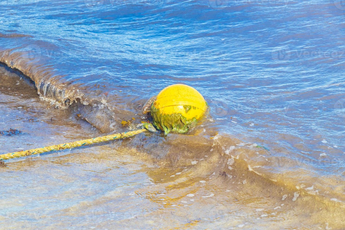 Blue water waves and ocean with buoy and ropes Mexico. photo