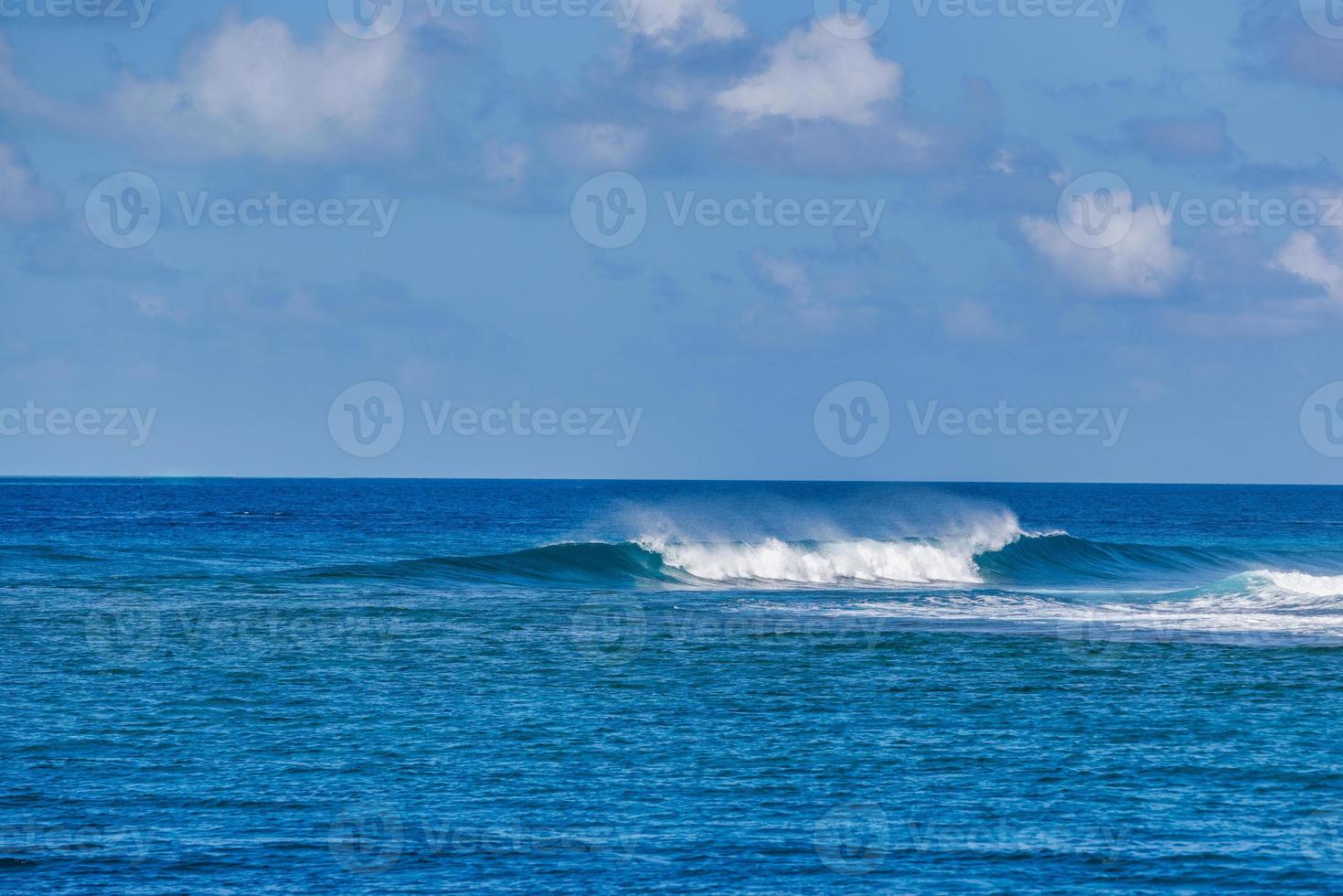 Beautiful panorama of splashing blue wave curl. Maldives island ocean lagoon with small waves splashing, idyllic nature scenic. Peaceful view photo