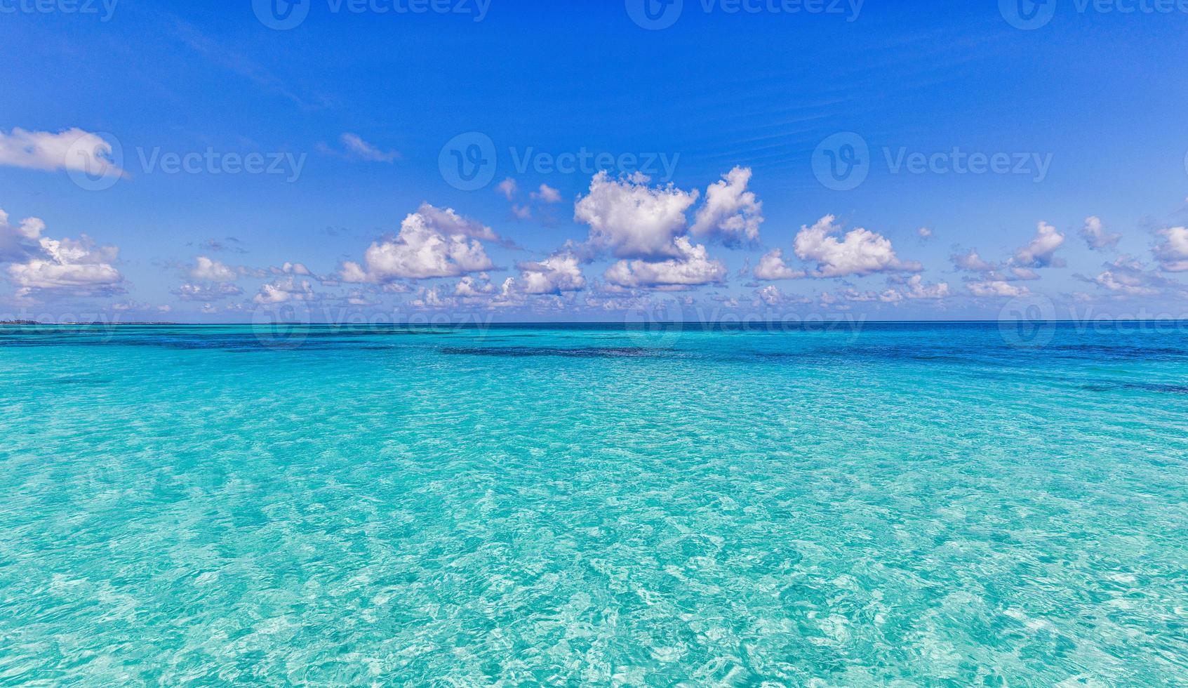 Bright beautiful seascape, sandy beach, clouds reflected in the ...