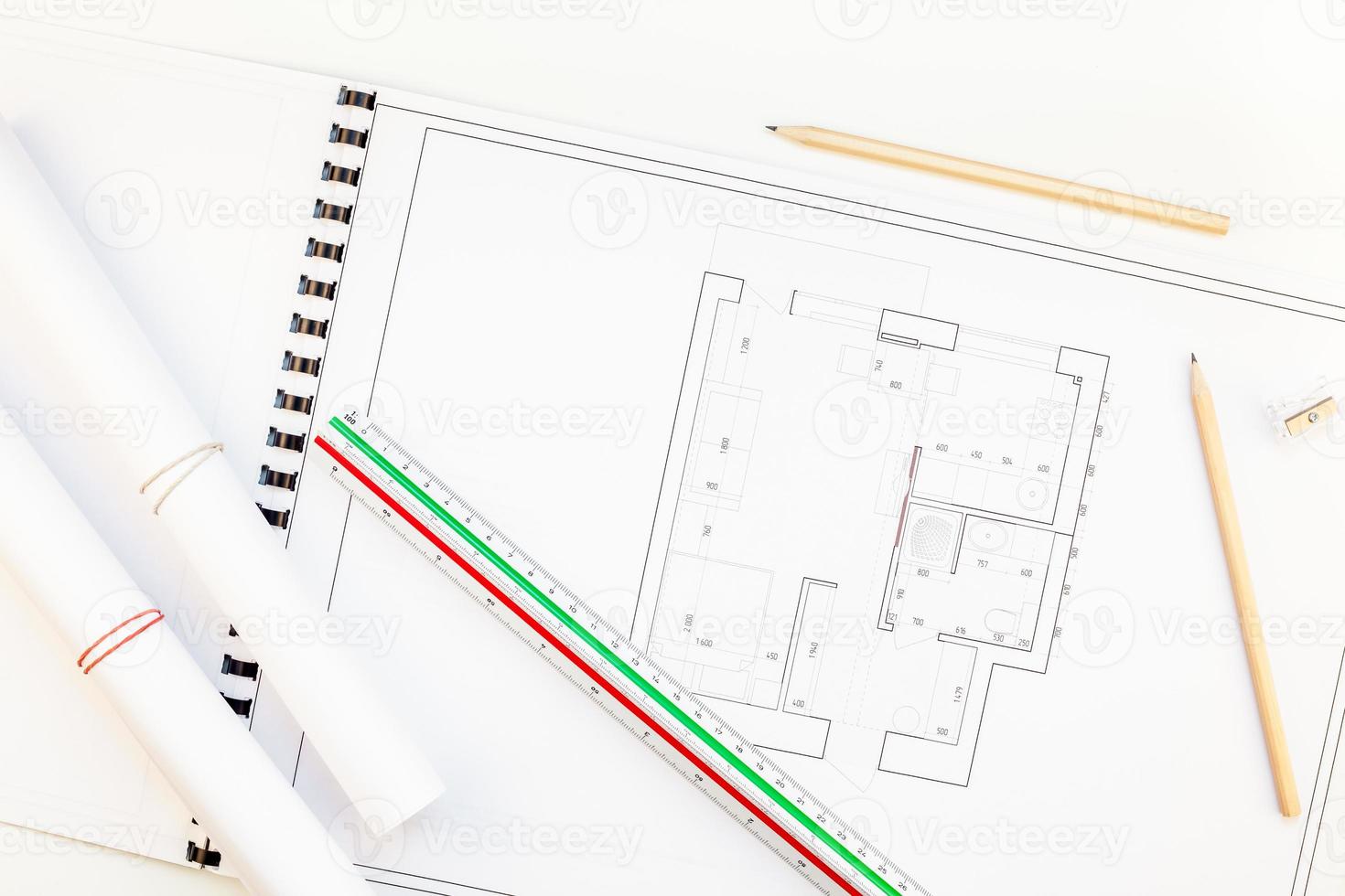 Interior designer table workplace with house plan photo