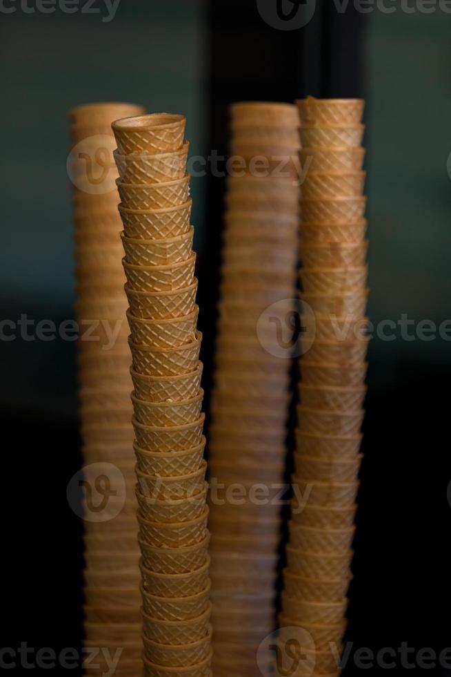 Ice Cream Cones Stacks on Dark Background photo