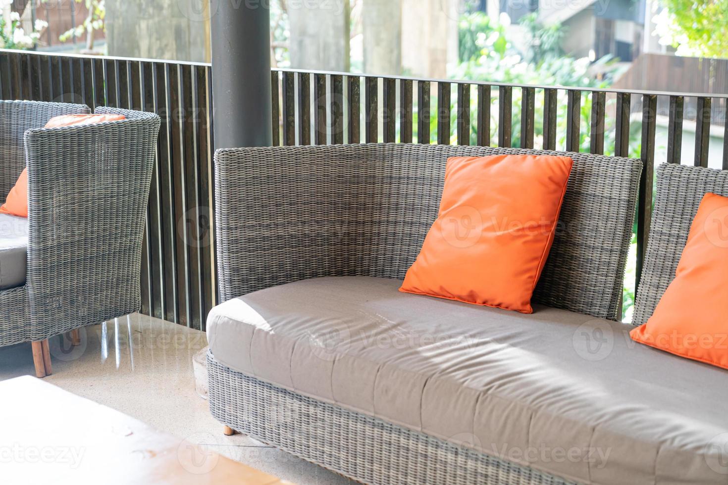 outdoor patio chair with pillow on balcony photo
