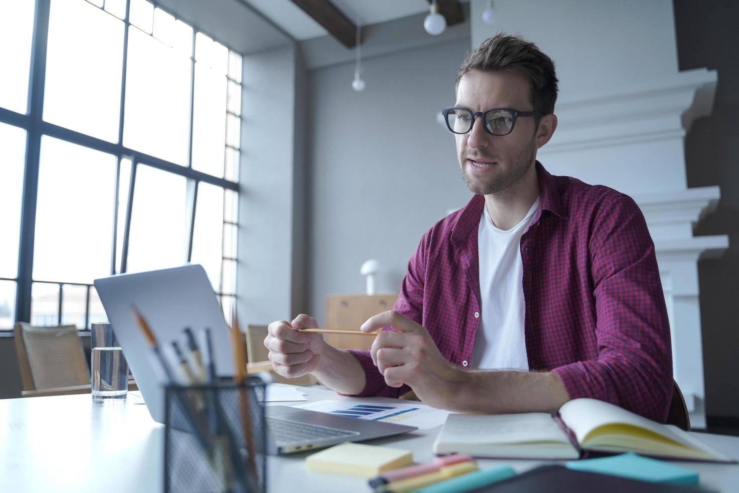 Focused man private financial advisor conducts training courses for individuals or companies online photo