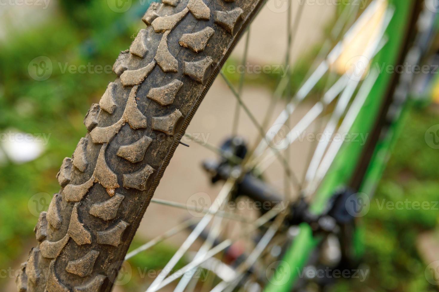 Bike waiting mechanic for repair in bicycle repair shop, outdoor. Bicycle wheel close up ready for examines, fixes modern cycle transmission system. Bike maintenance, sport shop concept. photo