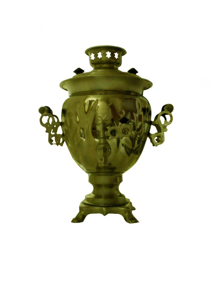 Old soviet samovar on a white background photo