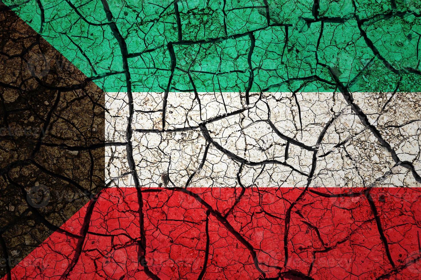 Dry soil pattern on the flag of Sudan. Country with drought concept. Water problem. Dry cracked earth country. photo