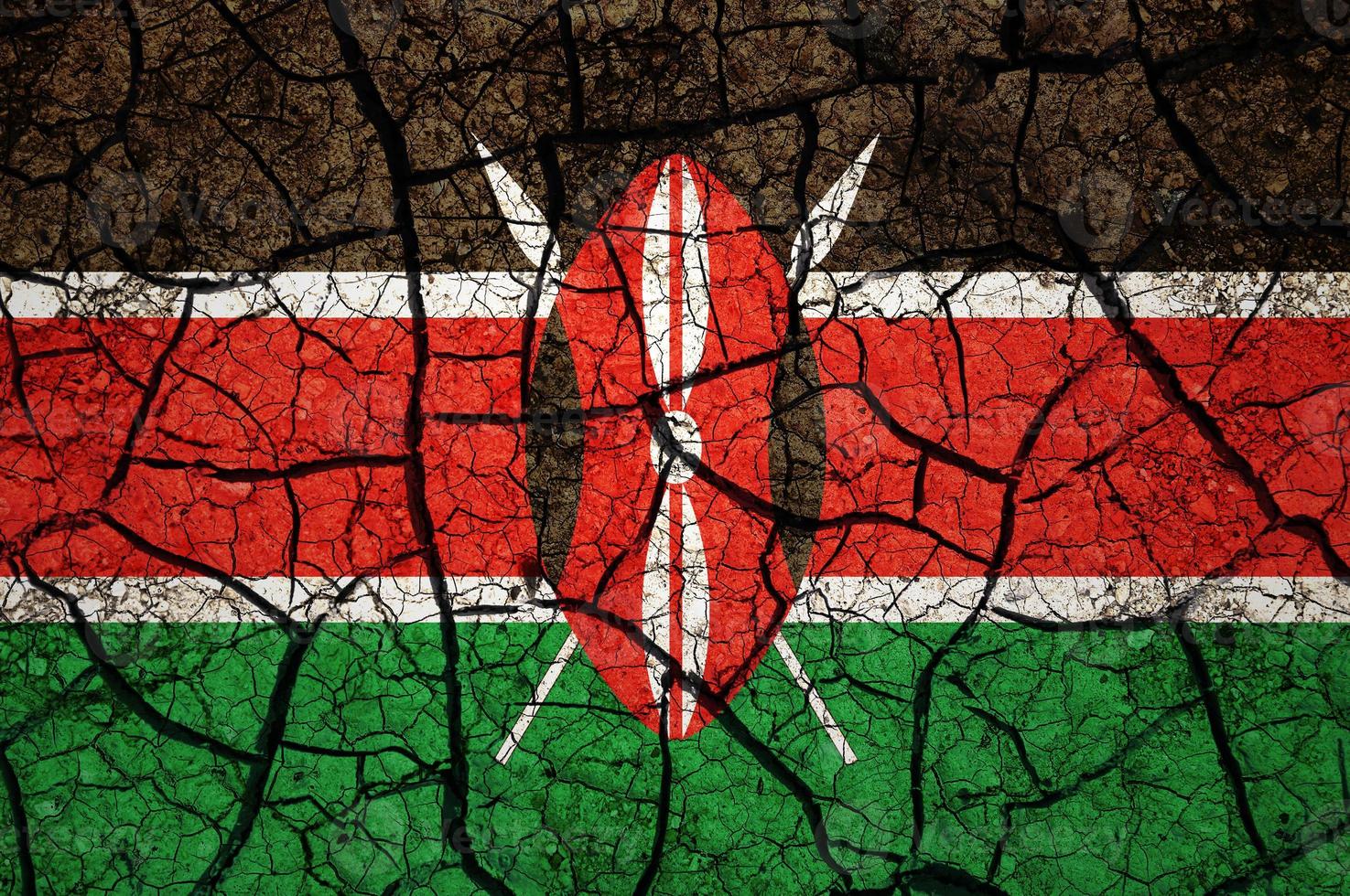 Dry soil pattern on the flag of Kenya. Country with drought concept. Water problem. Dry cracked earth country. photo