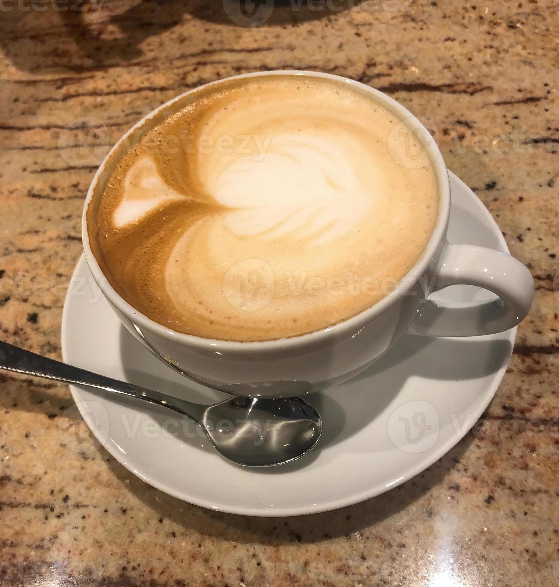 Cup of Cafe latte in a cafe 13088331 Stock Photo at Vecteezy