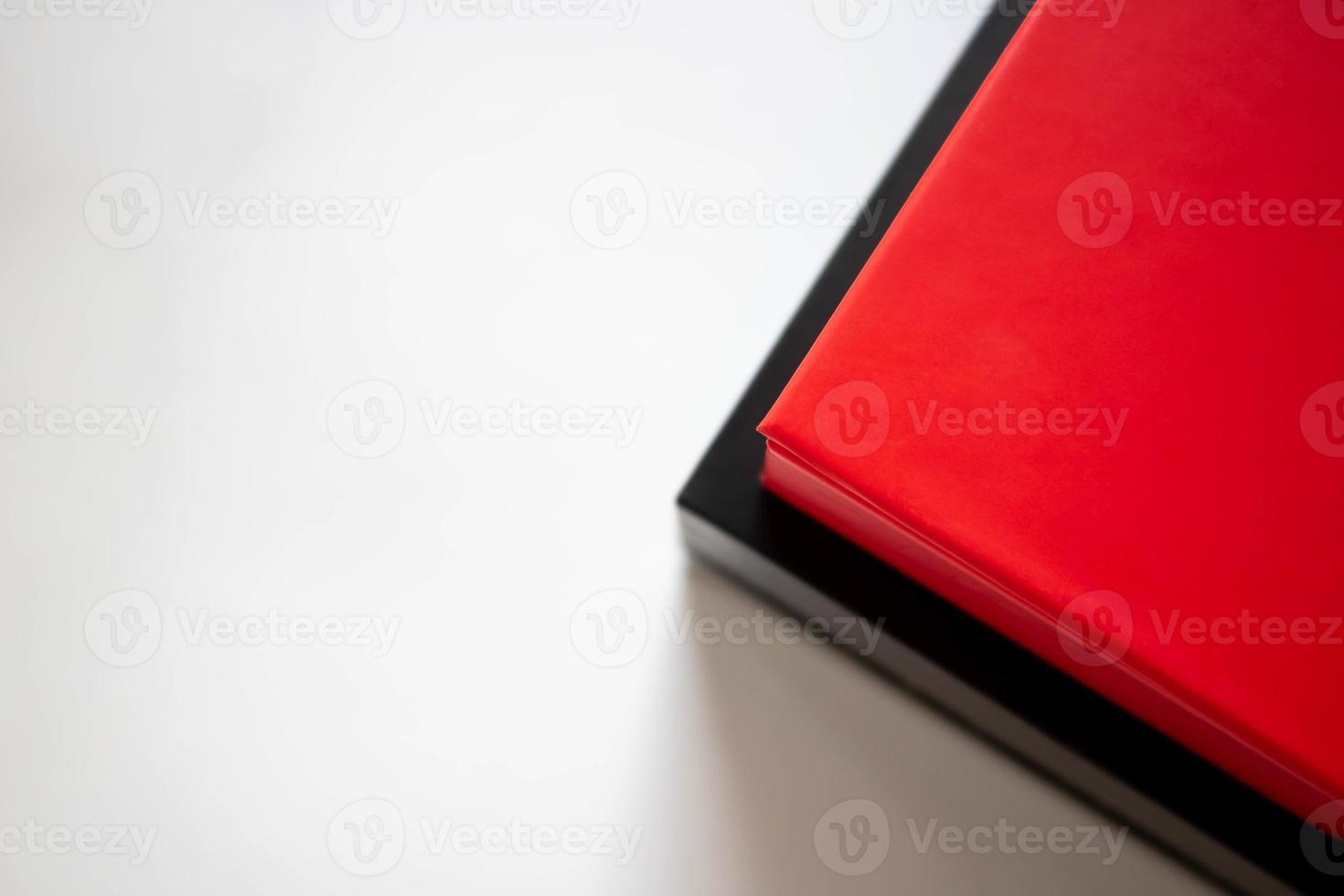 Two boxes red and black in a stack on a white background. Place for your text photo