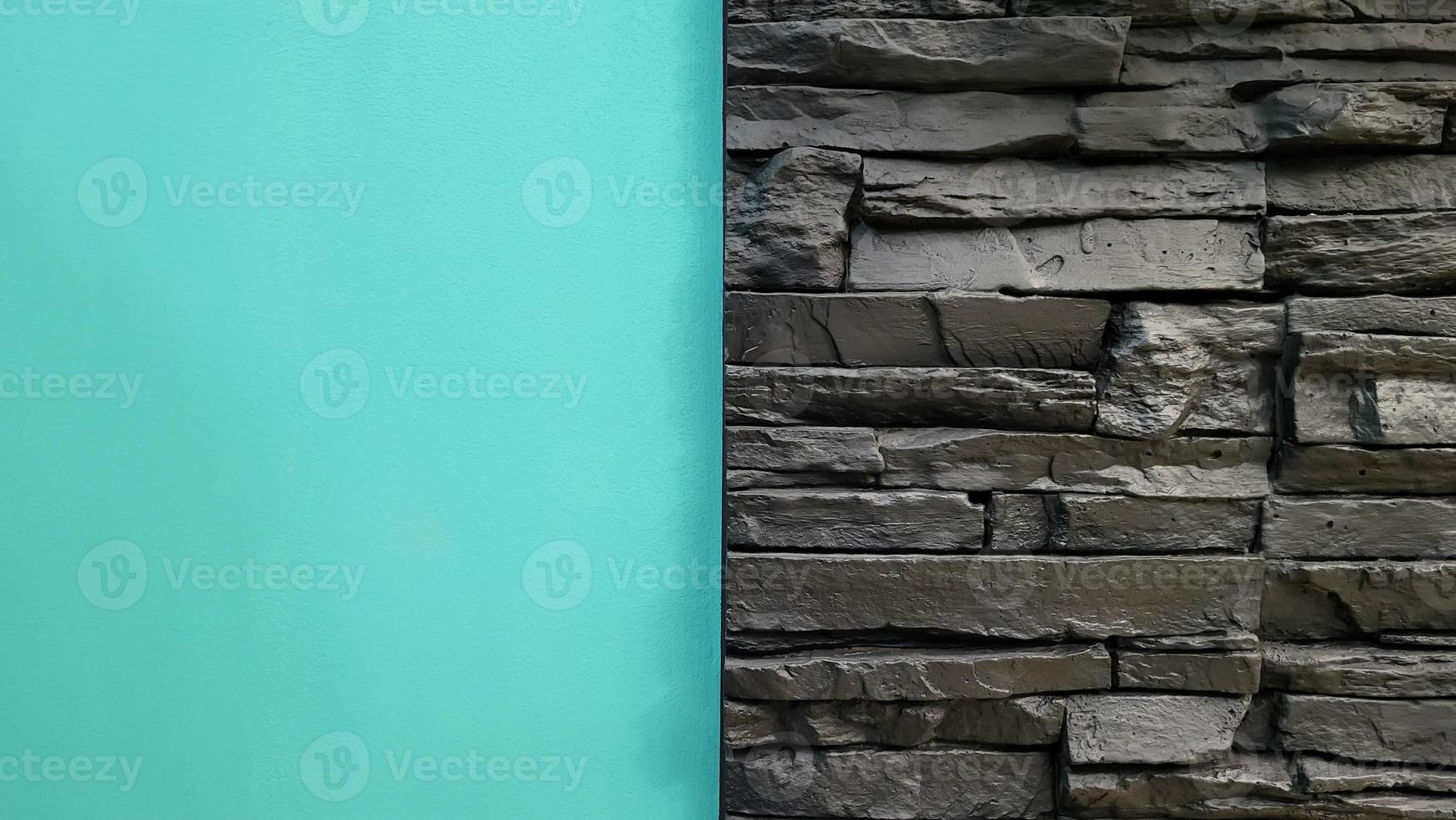 Turquoise wall and black brickwork for background or texture photo
