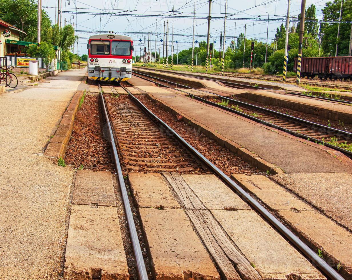 Railway lines in countryside on sunny day. Train journey photo