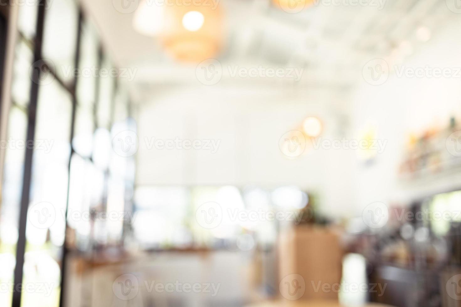 Blurred image inside a bright and beautifully decorated coffee shop. photo