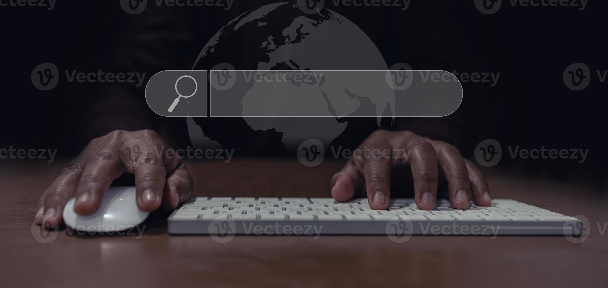 man's hand using mouse and keyboard to search for information, Searching for information in the big world photo