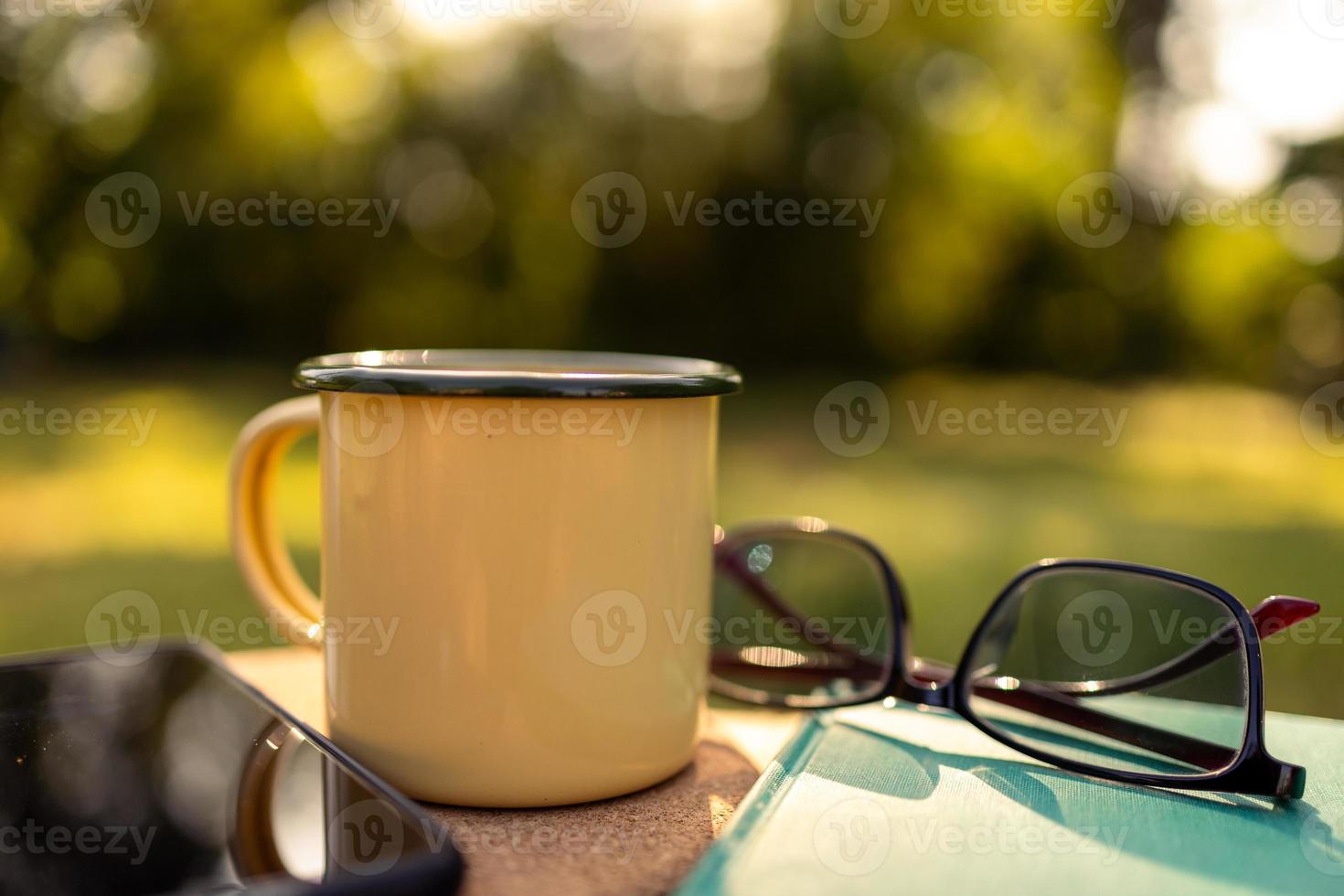 Coffee mugs in the backyard and morning sunshine. photo