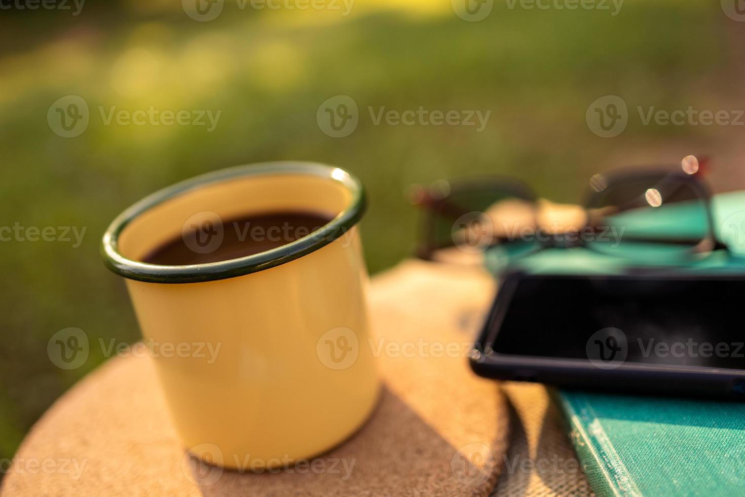Coffee mugs in the backyard and morning sunshine. photo
