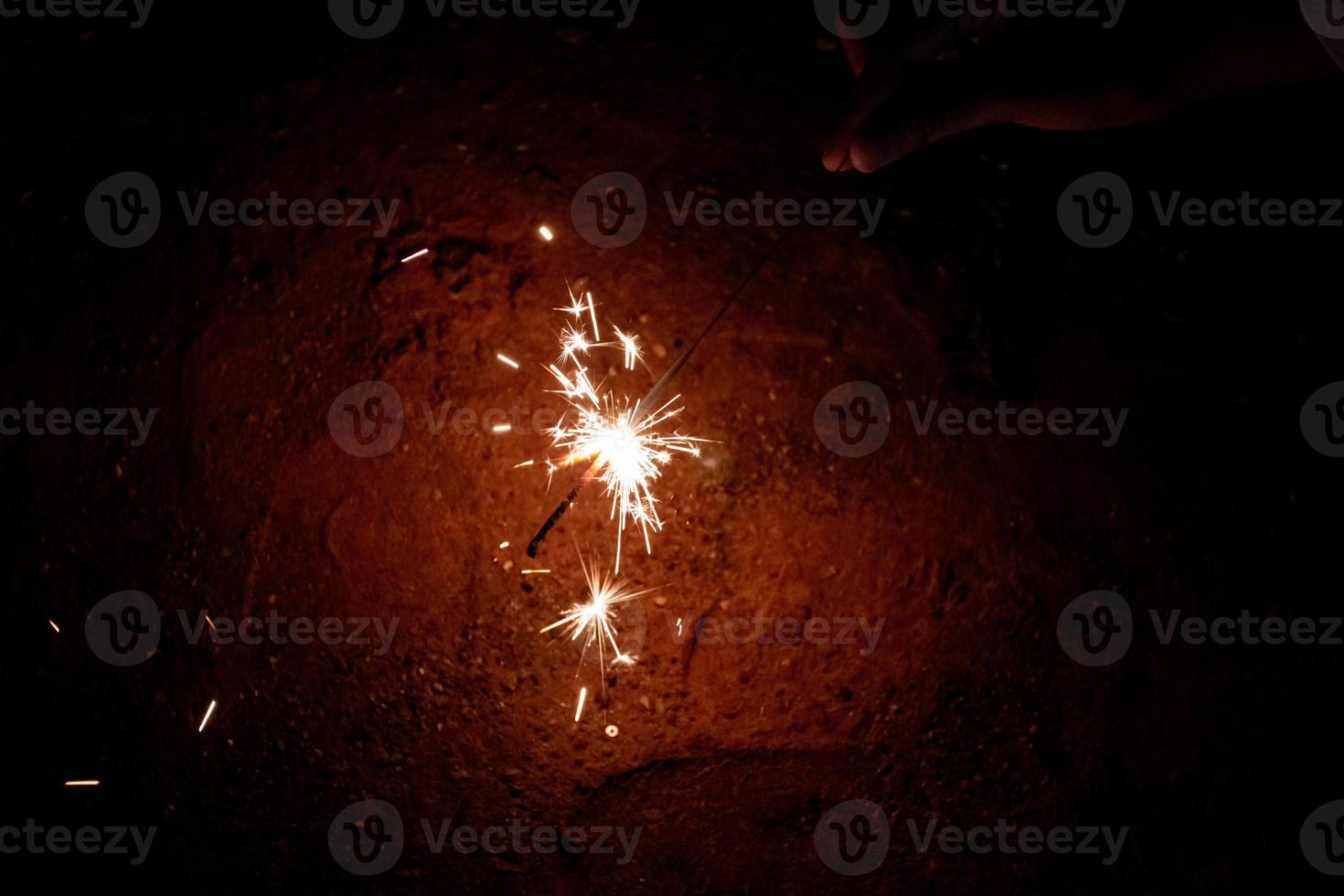 Lighting and glittering light with a cheerful child, fun at the party. photo