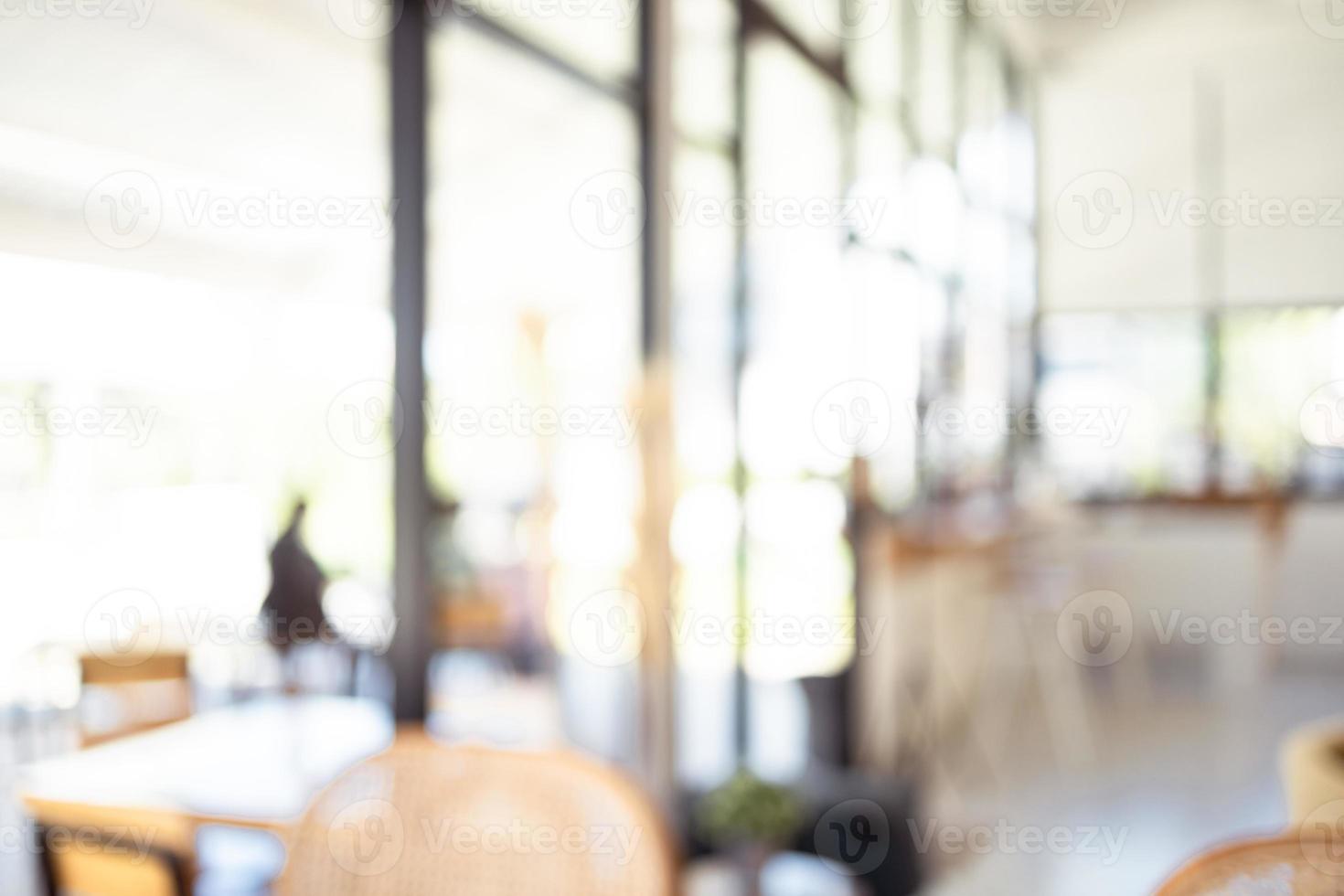 Blurred image inside a bright and beautifully decorated coffee shop. photo