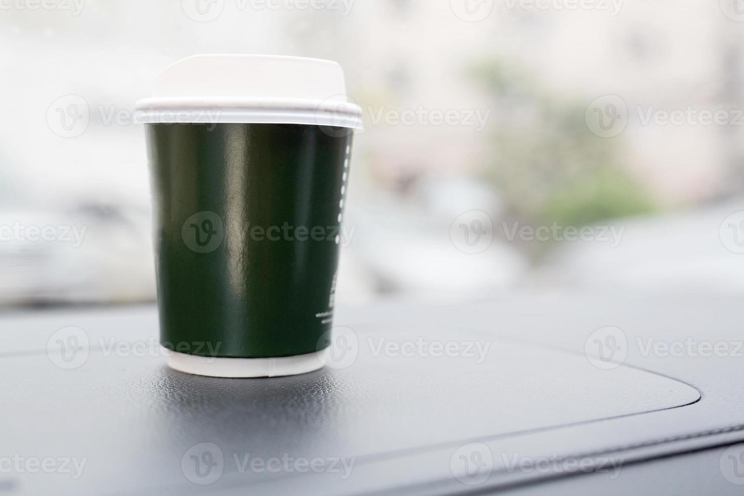 Eat a cup of coffee in the car during your commute to work. photo