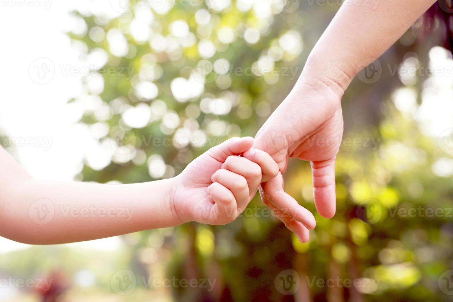 Children's hands with care, concern, warmth of mothers. photo