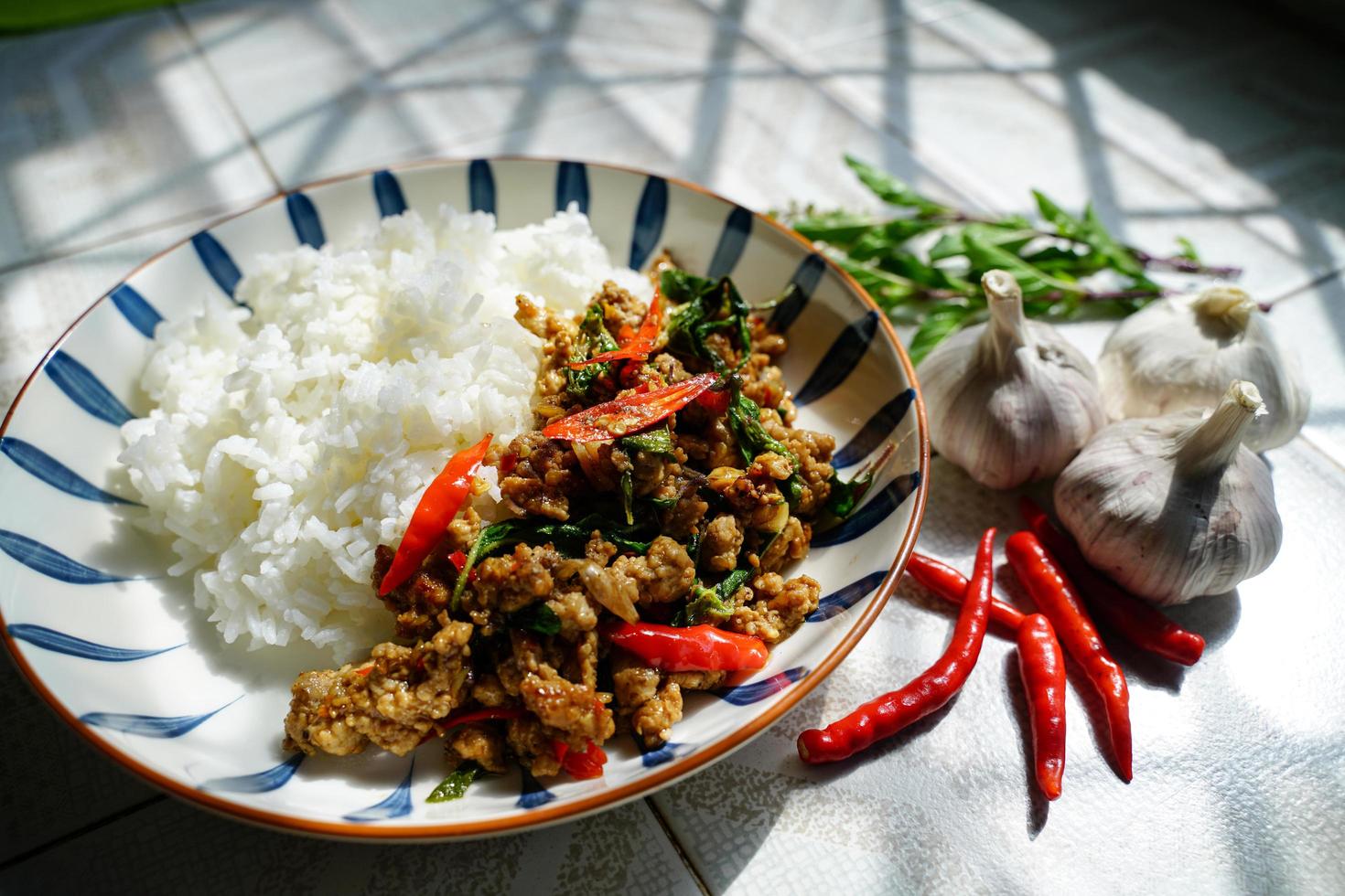 Stir-fried basil with minced pork is a popular dish because it's quick and easy to make.  spicy taste photo