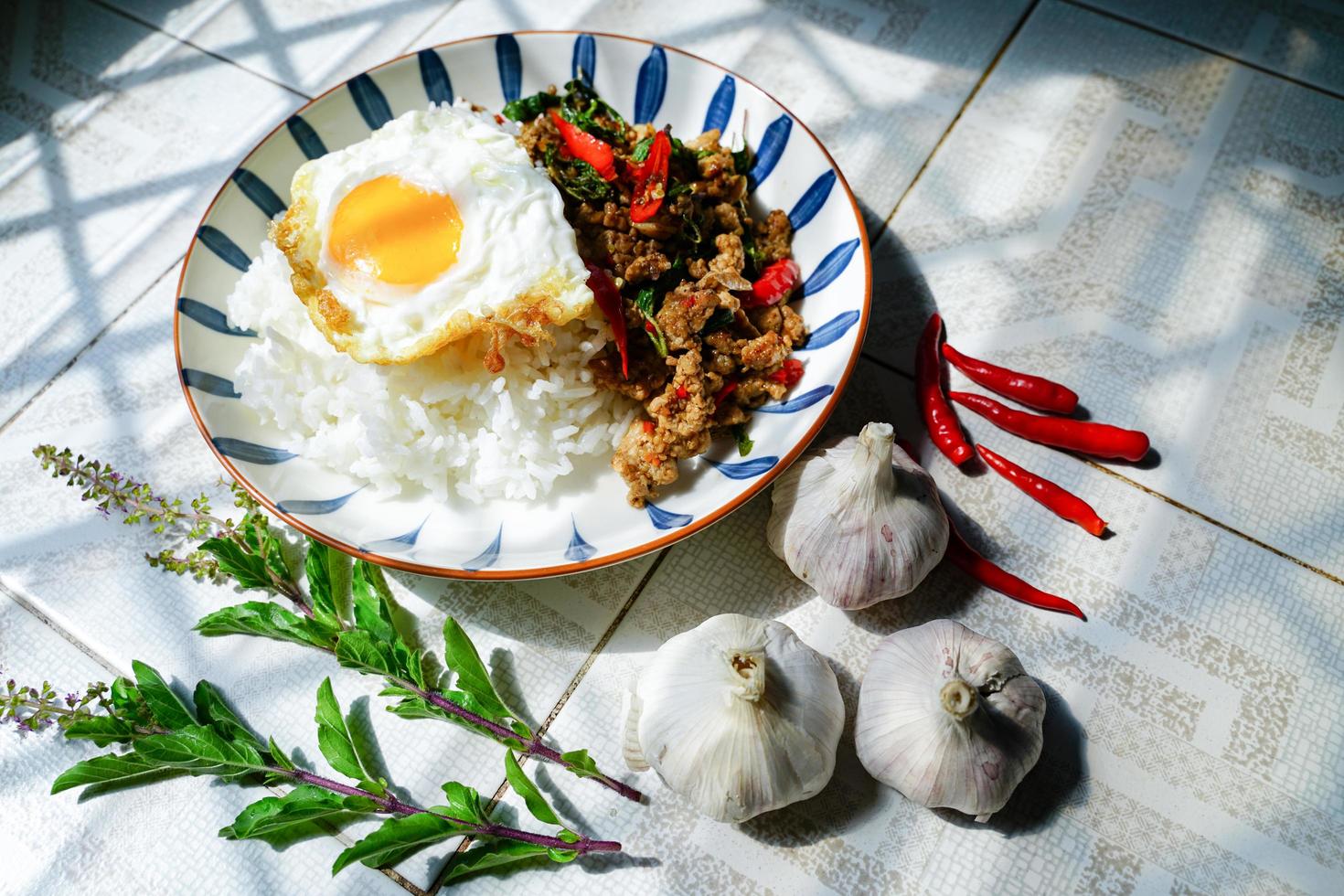 Stir Fried Basil with Minced Pork and Fried Egg is a popular dish because it's quick and easy to make.  spicy taste photo