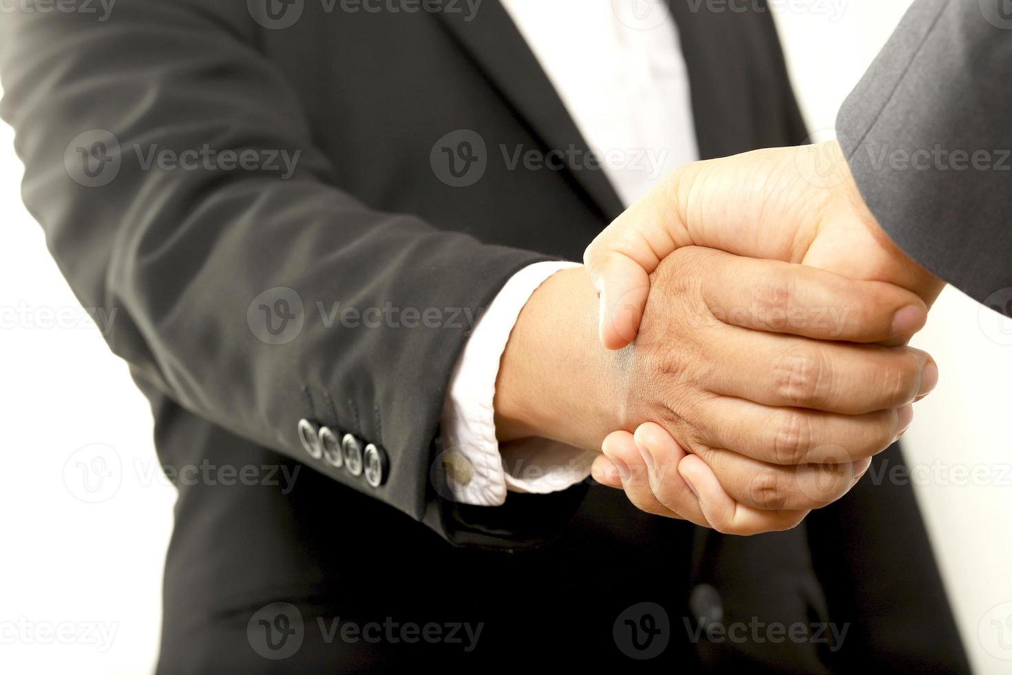 Salesman is carrying the car keys delivered to the customer at the showroom with a low interest offer. Special promotion photo