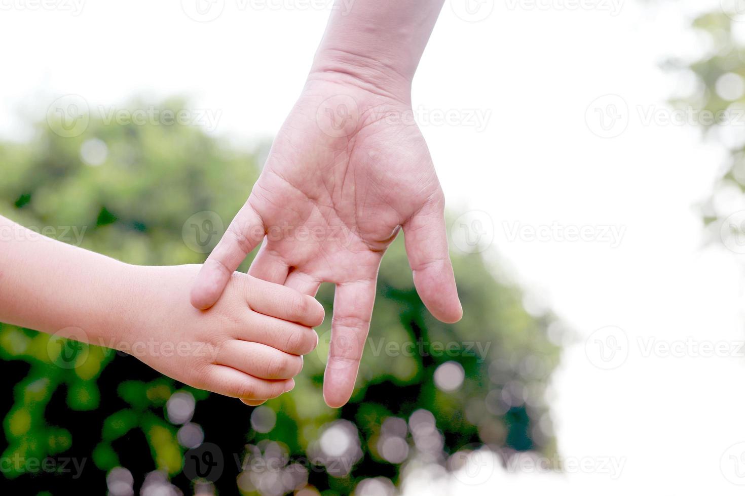 Children's hands with care, concern, warmth of mothers. photo