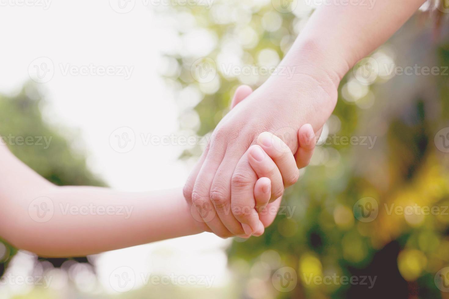 Children's hands with care, concern, warmth of mothers. photo