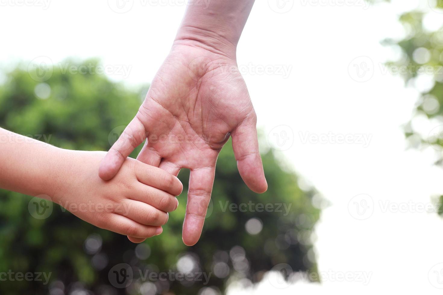Children's hands with care, concern, warmth of mothers. photo