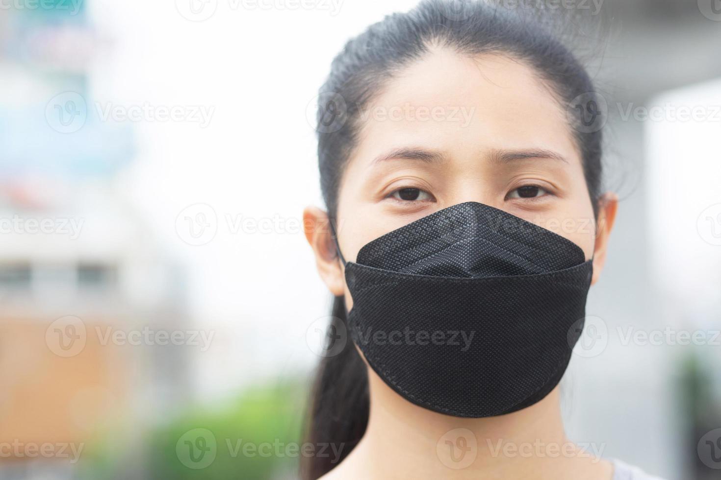 woman wearing a mask to prevent dust and bacteria photo