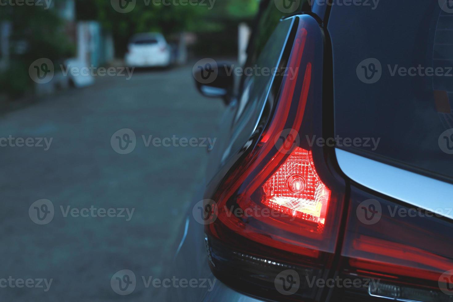 Light brake red color backside of car photo