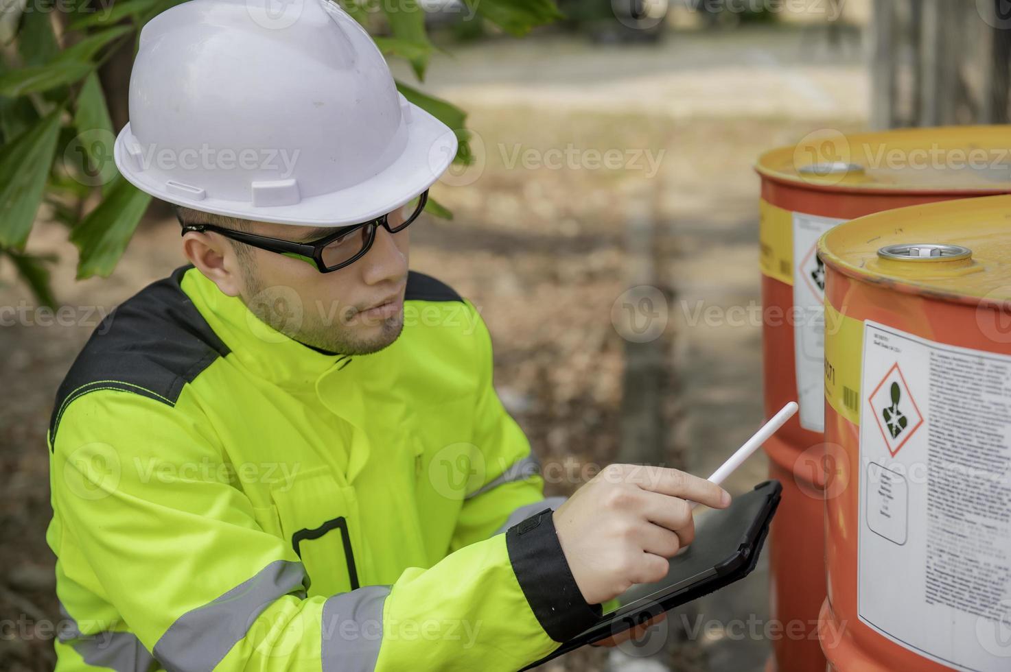Engineers work place to keep liquid helium,preventive maintenance schedule checking,Thailand people,Technicians and engineers discuss work together. photo