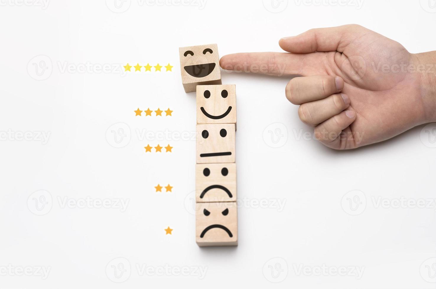 Highest quality of service. The hand of the customer rated the highest satisfaction with 5-star rating. Best service, Survey, The wooden block has an emoticon photo
