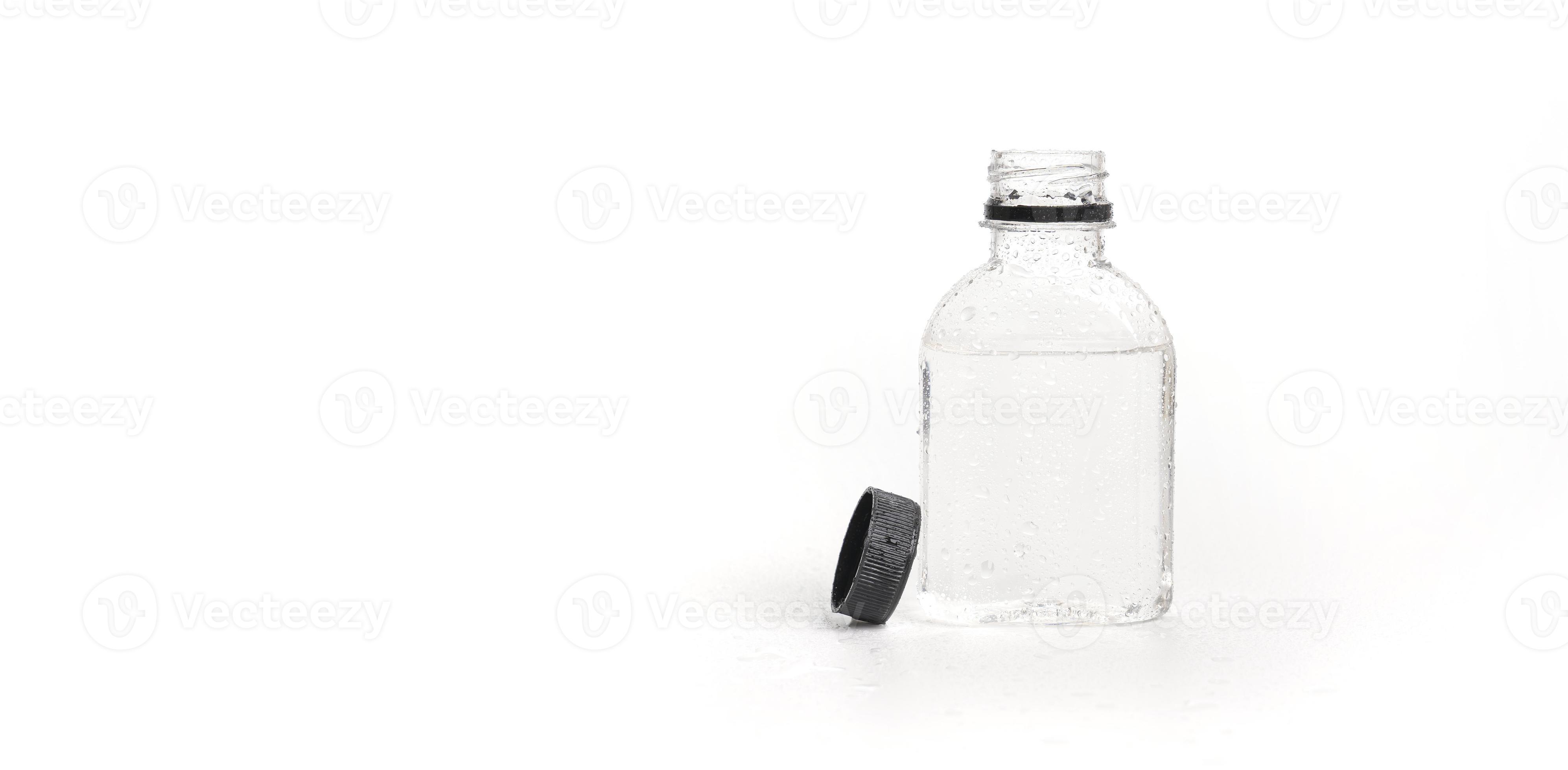 small plastic water bottle with water droplets and open lid on white
