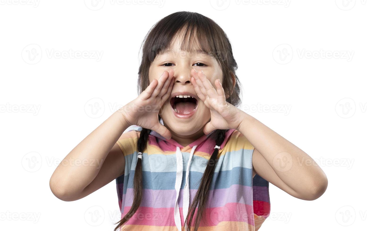 Surprised happy beauty asian little girl looking copy space in excitement. Expressive facial expressions. Presenting some product. Beautiful girl act like a telling secret isolated on white background photo