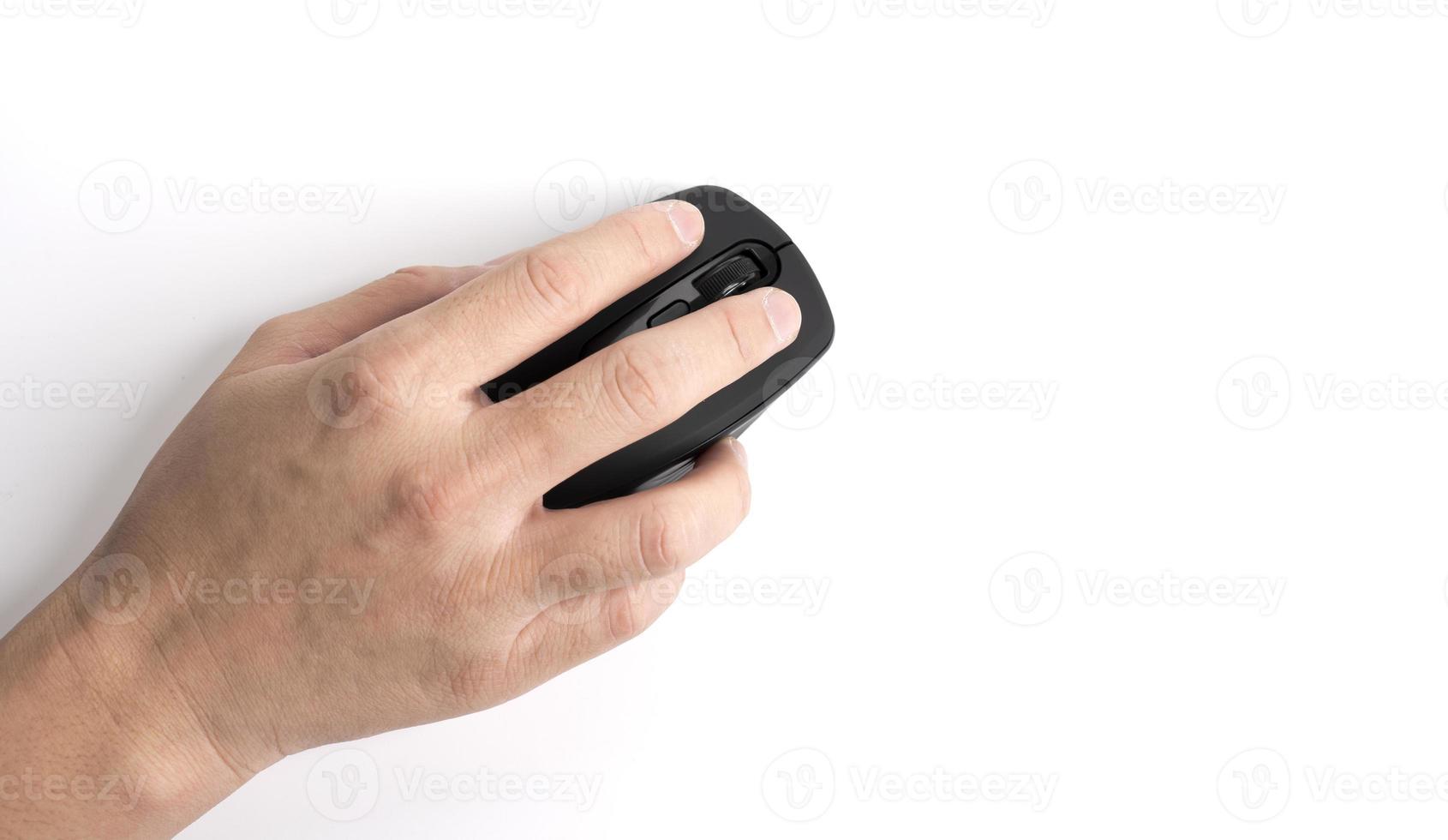 Close-up of hand using wireless computer mouse to find the necessary information on white background, top view. photo