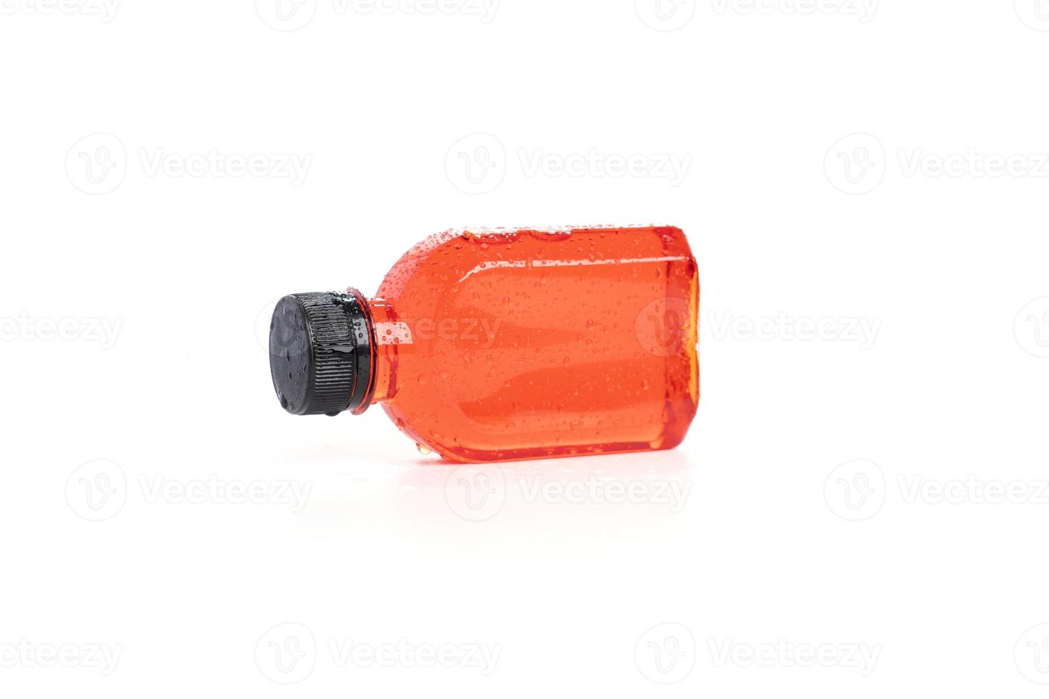 Fresh pomegranate juice packed in a small plastic bottle on white background. Tea in plastic bottle, Cold green tea, fruit juice photo